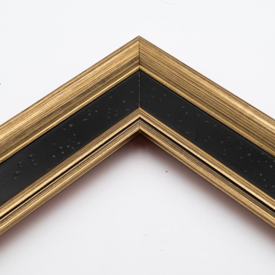 Corner detail of the black-and-gold Prestige frame's substantial moulding